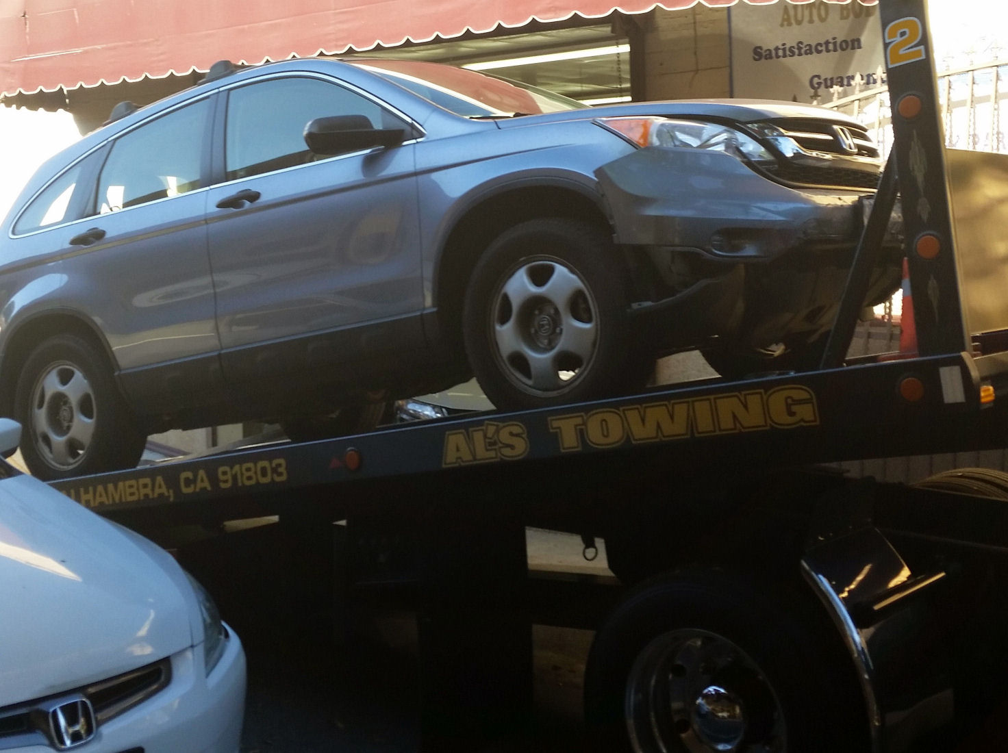 14-001-HondaOnFlatbed2.jpg 211.7K